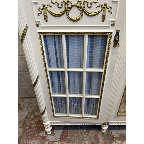 3 - A French Louis XVI style white and gold painted triple wardrobe - approx. 229cm high x 225cm wide x ... 