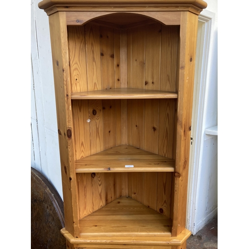 33 - A pine free standing corner cabinet - approx. 183cm high