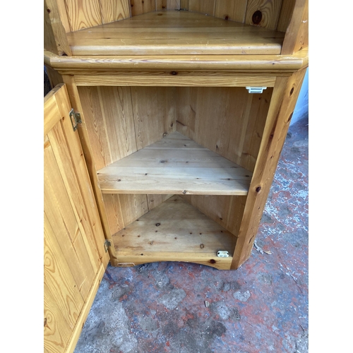 33 - A pine free standing corner cabinet - approx. 183cm high