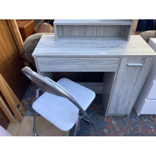 39 - A modern grey wood effect dressing table with Sainsbury's folding chair