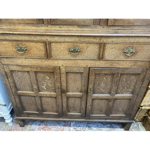 4 - An 18th century Welsh inlaid oak Deuddarn cupboard - approx. 197cm high x 144cm wide x 56cm deep