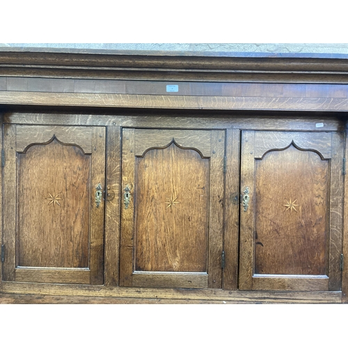 4 - An 18th century Welsh inlaid oak Deuddarn cupboard - approx. 197cm high x 144cm wide x 56cm deep