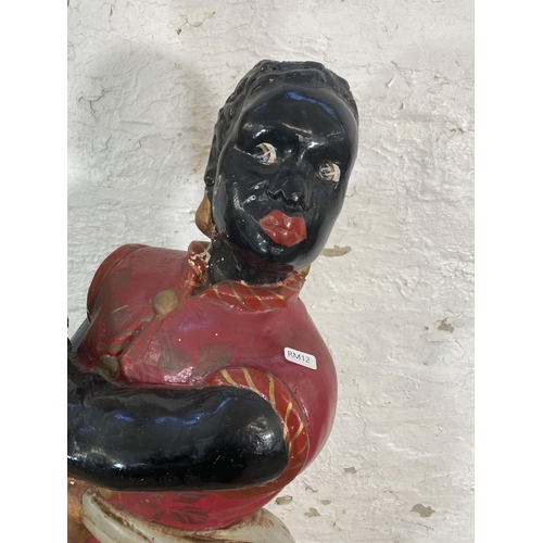 48 - An early 20th century Blackamoor polychrome painted composite floor standing lamp - approx. 176cm hi... 