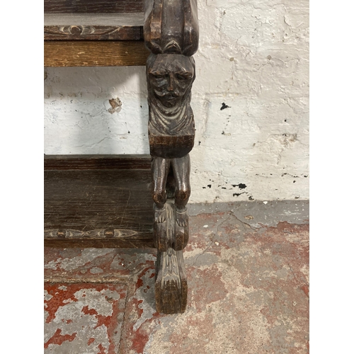 49 - A late 19th/early 20th century carved oak three tier shelving unit - approx. 80cm high x 85cm wide x... 