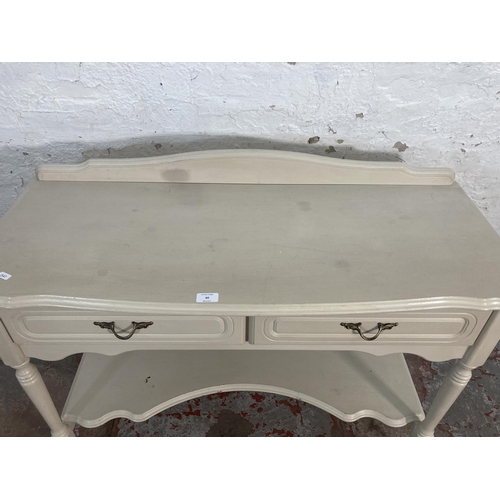 60 - A French style grey painted two drawer console table - approx. 85cm high x 107cm wide x 44cm deep