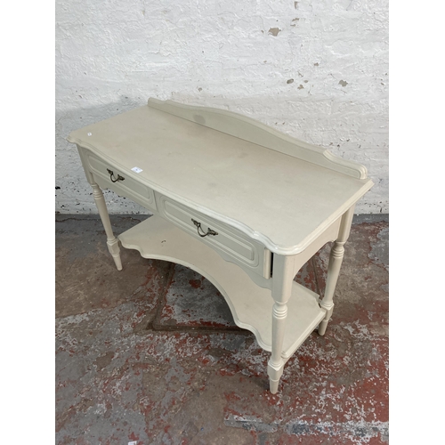 60 - A French style grey painted two drawer console table - approx. 85cm high x 107cm wide x 44cm deep