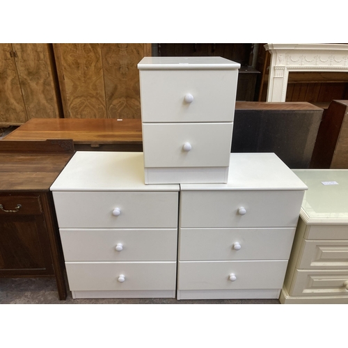 66 - Three modern white laminate bedside chests of drawers