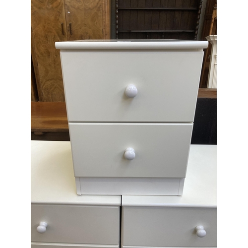 66 - Three modern white laminate bedside chests of drawers