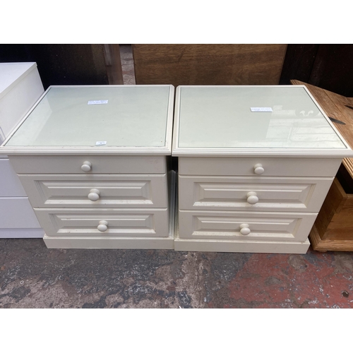 68 - A pair of modern white laminate bedside chest of drawers - approx. 63cm high x 64cm wide x 57cm deep