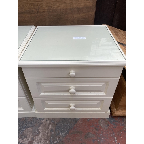 68 - A pair of modern white laminate bedside chest of drawers - approx. 63cm high x 64cm wide x 57cm deep