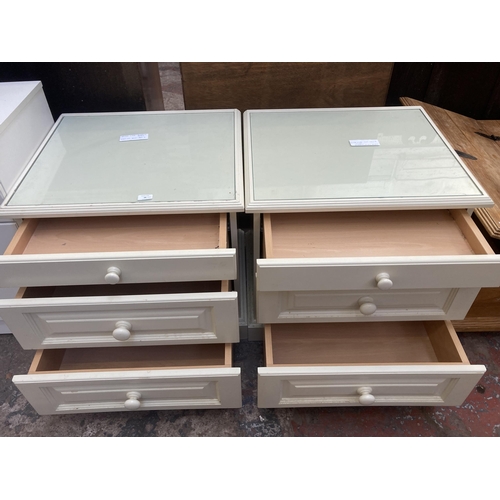 68 - A pair of modern white laminate bedside chest of drawers - approx. 63cm high x 64cm wide x 57cm deep