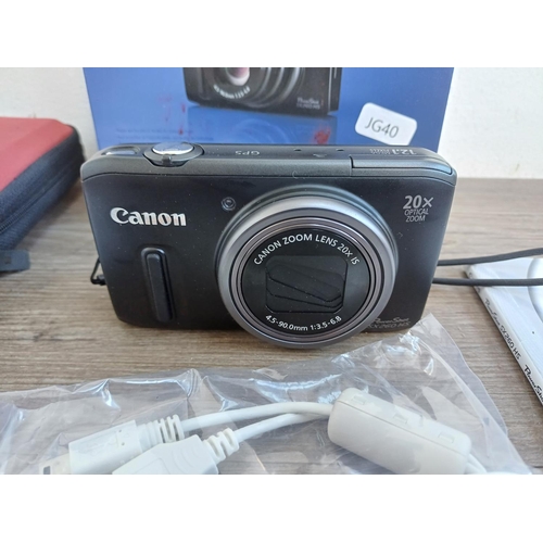 315A - A boxed and cased Canon PowerShot SX260 HS 12.1mp compact digital camera with charger, software disc... 