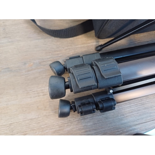 343 - Two cased items, one Ecooproo Gomu spotting scope with tripod and one height adjustable tripod