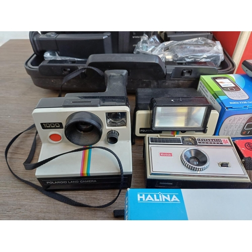 345 - A collection of items to include boxed Eumig 614D Super8/Standard8 cine projector, boxed Halina Supe... 