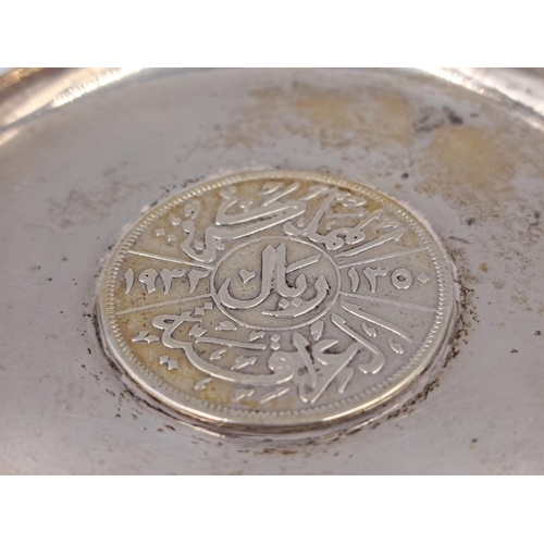 2431 - An Iraqi white metal one riyal coin dish - approx. gross weight 44g and 8.5cm diameter