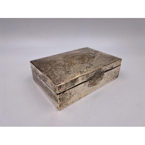 2436 - A hallmarked sterling silver cigarette box with engraved Latin crest - approx. gross weight 280g and... 