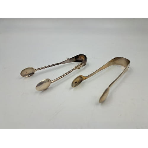 2450 - Two pairs of hallmarked Birmingham silver sugar tongs, one Liberty & Co. Ltd. and one Thomas Hayes -... 