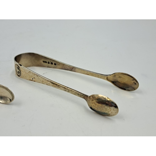 2450 - Two pairs of hallmarked Birmingham silver sugar tongs, one Liberty & Co. Ltd. and one Thomas Hayes -... 