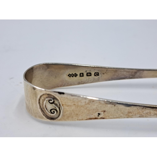 2450 - Two pairs of hallmarked Birmingham silver sugar tongs, one Liberty & Co. Ltd. and one Thomas Hayes -... 