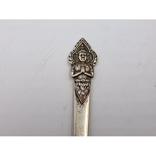 2451 - A sterling silver spoon spoon with embossed buddha design, stamped S. AM to reverse - approx. gross ... 