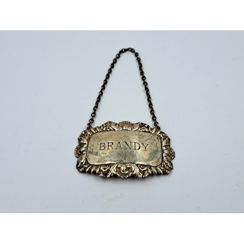 2460 - A hallmarked Birmingham silver brandy decanter label - approx. gross weight 14.26g