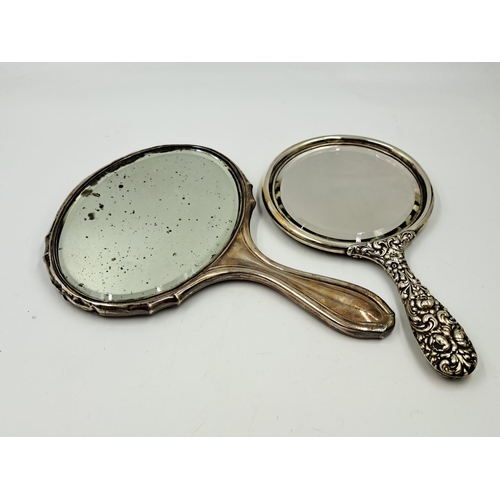 2497 - Two sterling silver vanity mirrors, one hallmarked Birmingham and one repousse