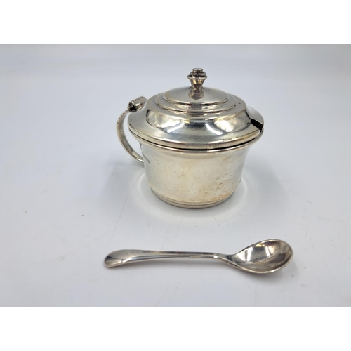 2498 - A Lanson Ltd. hallmarked Birmingham silver condiment pot with spoon and blue glass insert - approx. ... 