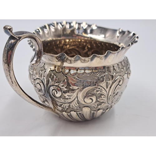 2499 - A Victorian Walker & Hall hallmarked Sheffield silver creamer with repousse decoration, dated 1898 -... 