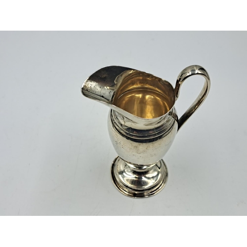 2502 - An Edwardian Edward Barnard & Sons Ltd. hallmarked London silver creamer on pedestal base, dated 190... 