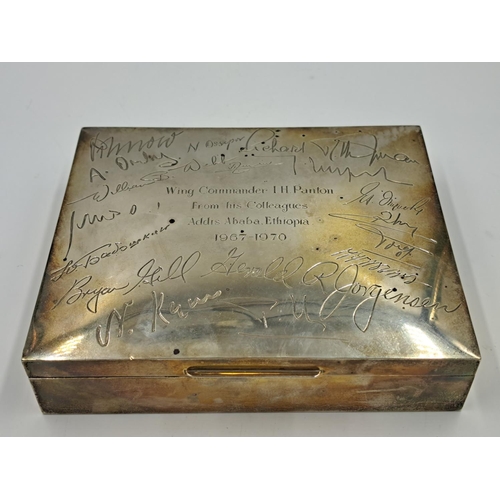 2507 - A mid 20th century Walker & Hall hallmarked Sheffield silver cigar box presented to Wing Commander I... 