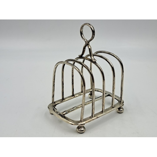 2510 - A Walker & Hall hallmarked Sheffield silver four slice toast rack - approx. gross weight 133.33g and... 