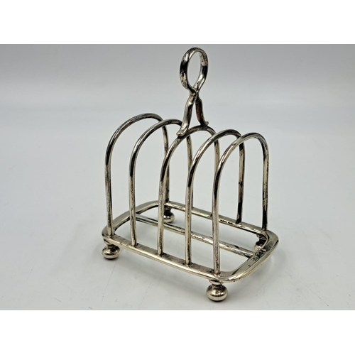 2510 - A Walker & Hall hallmarked Sheffield silver four slice toast rack - approx. gross weight 133.33g and... 