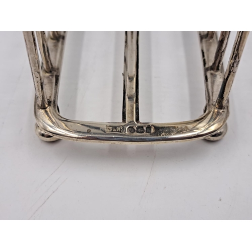 2510 - A Walker & Hall hallmarked Sheffield silver four slice toast rack - approx. gross weight 133.33g and... 