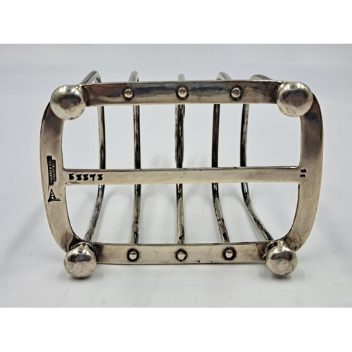 2510 - A Walker & Hall hallmarked Sheffield silver four slice toast rack - approx. gross weight 133.33g and... 