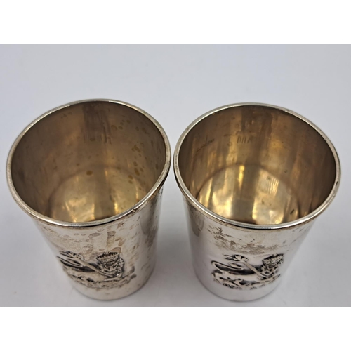 2511 - A pair of 20th century B.A. Sevadjian Ethiopian .830 silver drinking cups with embossed lion design ... 