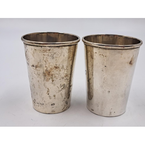 2511 - A pair of 20th century B.A. Sevadjian Ethiopian .830 silver drinking cups with embossed lion design ... 