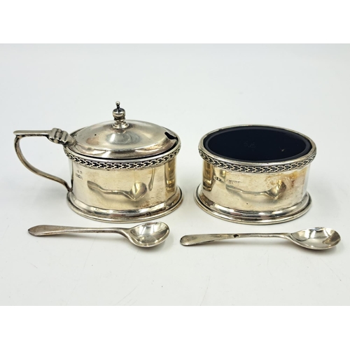 2513 - Two Docker & Burn Ltd. hallmarked Birmingham silver condiment pots with spoons and glass inserts, da... 