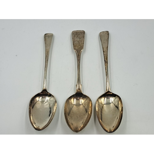 2517 - Three George III hallmarked silver spoons, one Dublin dated 1823, one Richard Crossley London dated ... 