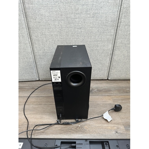 406 - A Samsung TV speaker system comprising PS-WK450 subwoofer and HW-K450 soundbar