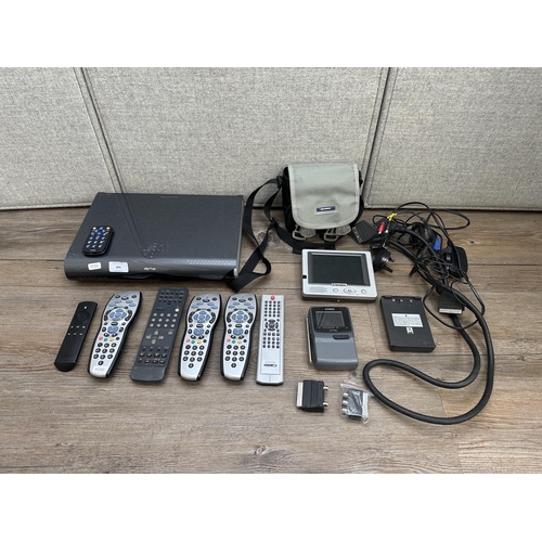 409 - A collection of AV items to include Sky Plus HD box, Casio TV-770 pocket TV, remote controls etc.