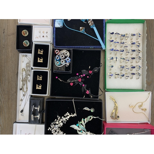 932 - A collection of boxed costume jewellery to include Life Charms bracelet, Heathergems pin brooch etc.