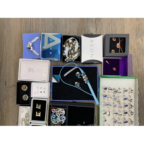 932 - A collection of boxed costume jewellery to include Life Charms bracelet, Heathergems pin brooch etc.