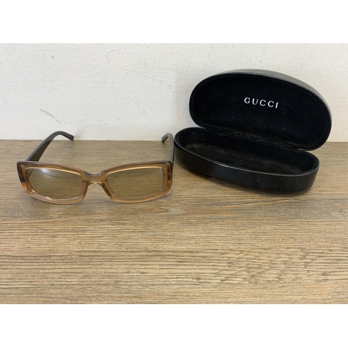 936 - A pair of vintage women's sunglasses in Gucci case