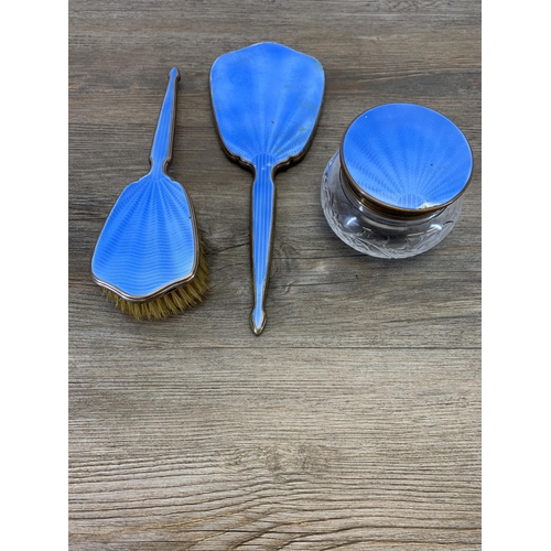 937 - An Art Deco blue enamel three piece dressing table set