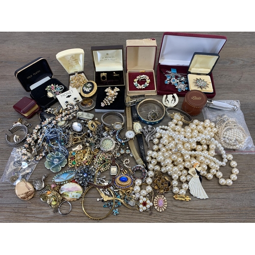 945 - A collection of vintage costume jewellery and wristwatches to include brooches, blue enamel and whit... 