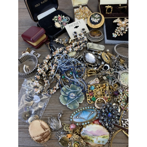 945 - A collection of vintage costume jewellery and wristwatches to include brooches, blue enamel and whit... 