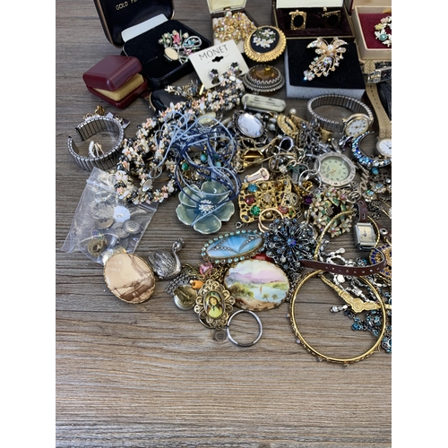 945 - A collection of vintage costume jewellery and wristwatches to include brooches, blue enamel and whit... 