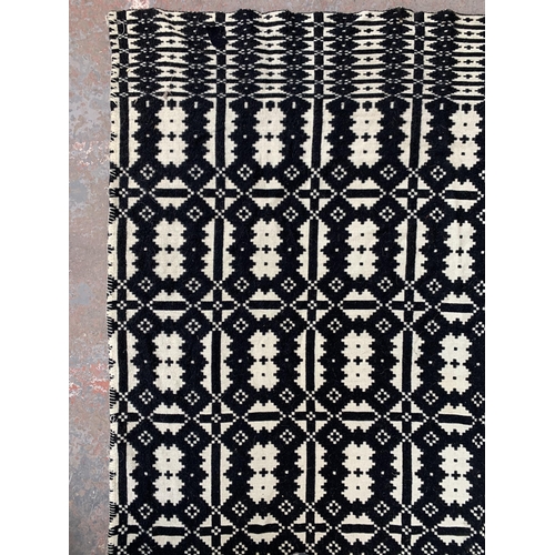 949 - A vintage black and white handmade woollen blanket