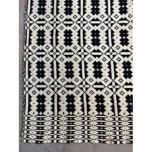 949 - A vintage black and white handmade woollen blanket