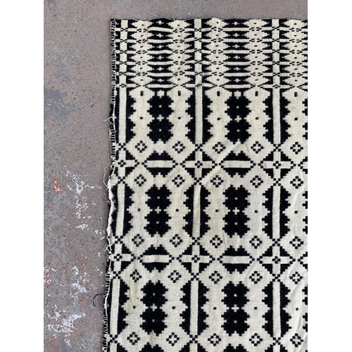 949 - A vintage black and white handmade woollen blanket